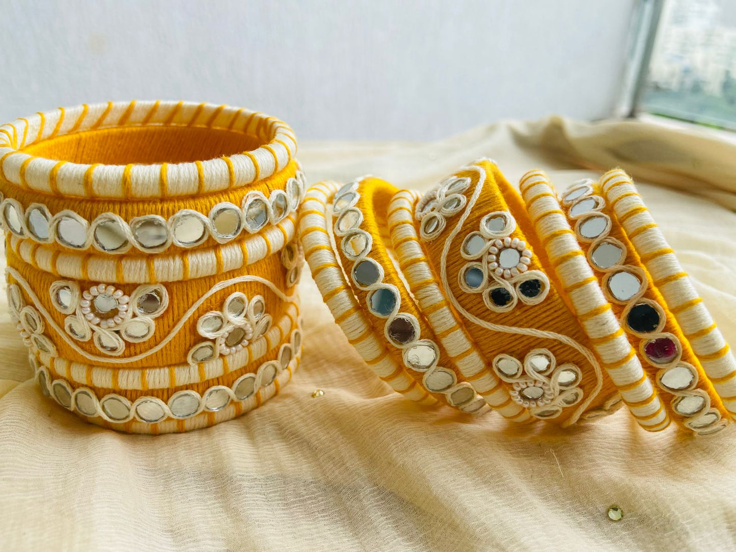 Elegant Yellow and White Thread Bangles with Mirror Work