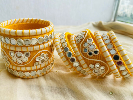 Elegant Yellow and White Thread Bangles with Mirror Work