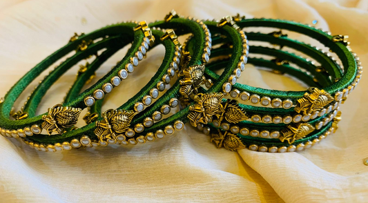 Elegant Green Bangles with Pearl and Peacock Feather Motifs